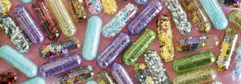 capsules filled with different types of glitter