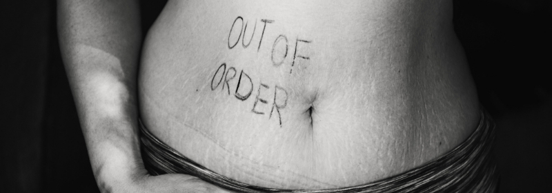 stomach with 'out of order' written on it