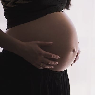 woman holding her pregnant belly
