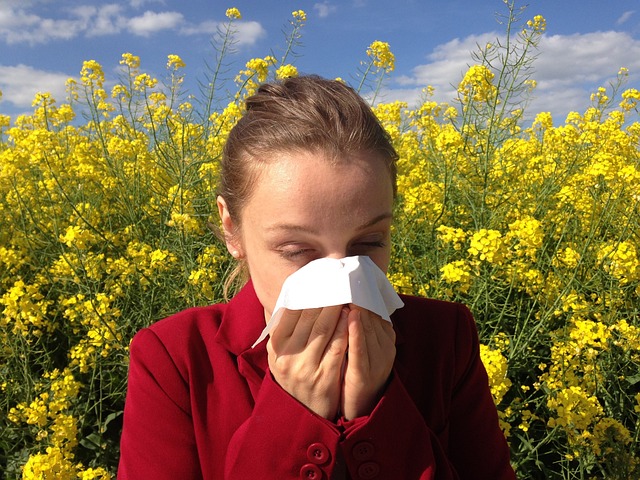 woman sneezing from an allergy